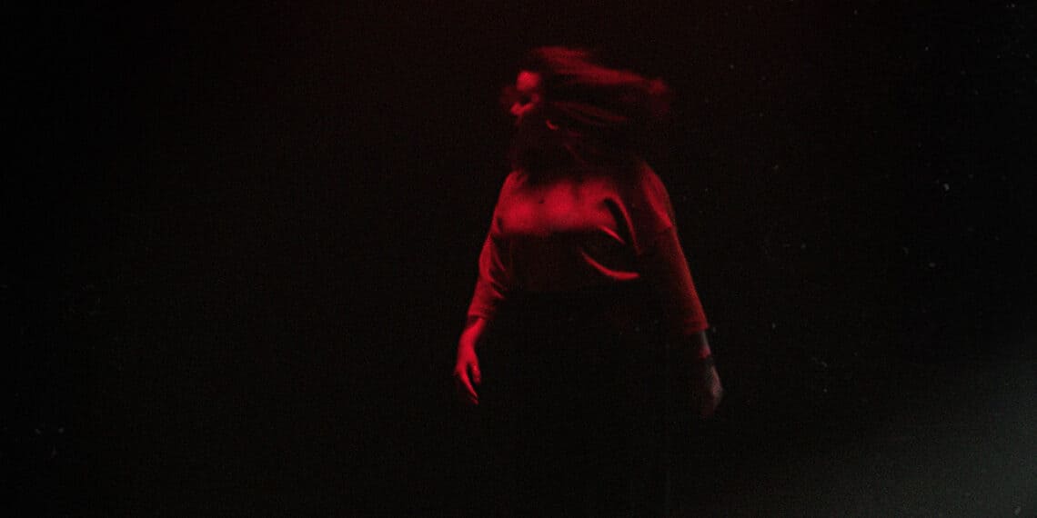 Woman in red lit light