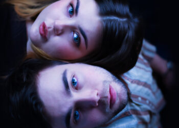 Norwegian sibling duo Hella the Movie lying down together.